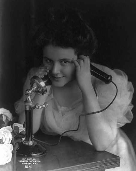 a woman in a dress and a microphone in a microphone