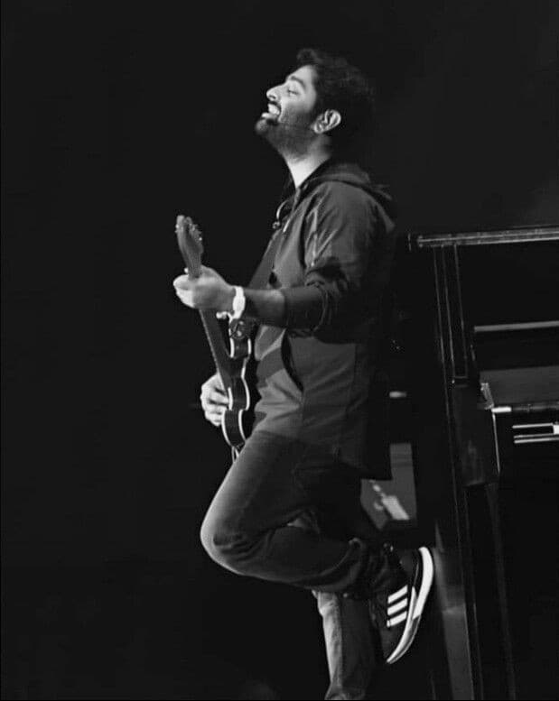 a man with a guitar and a guitar