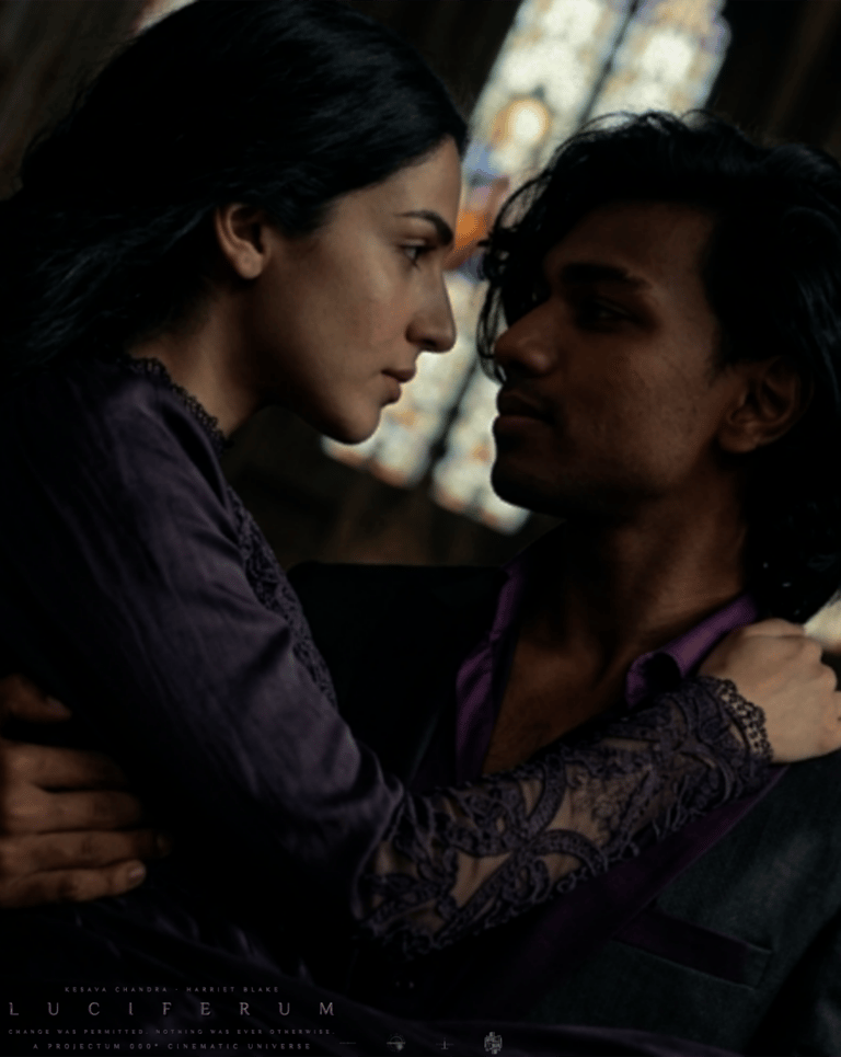Kesava Chandra as The Raconteur carrying Harriet Blake as Valerina in Luciferum (2031)