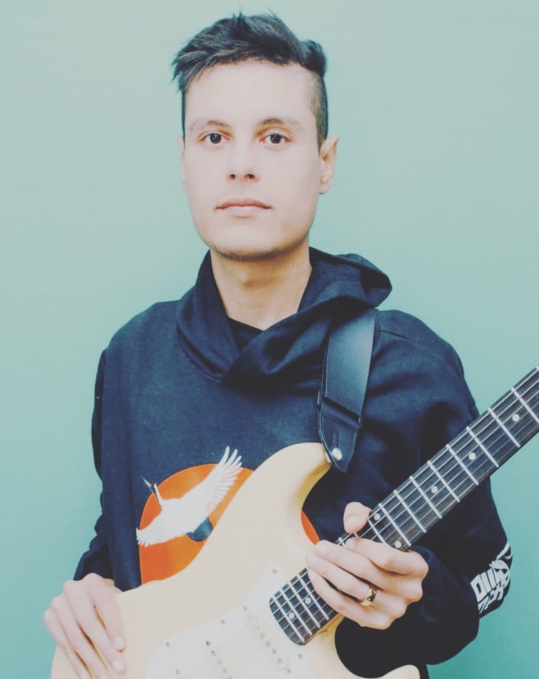 a man with a guitar and a guitar