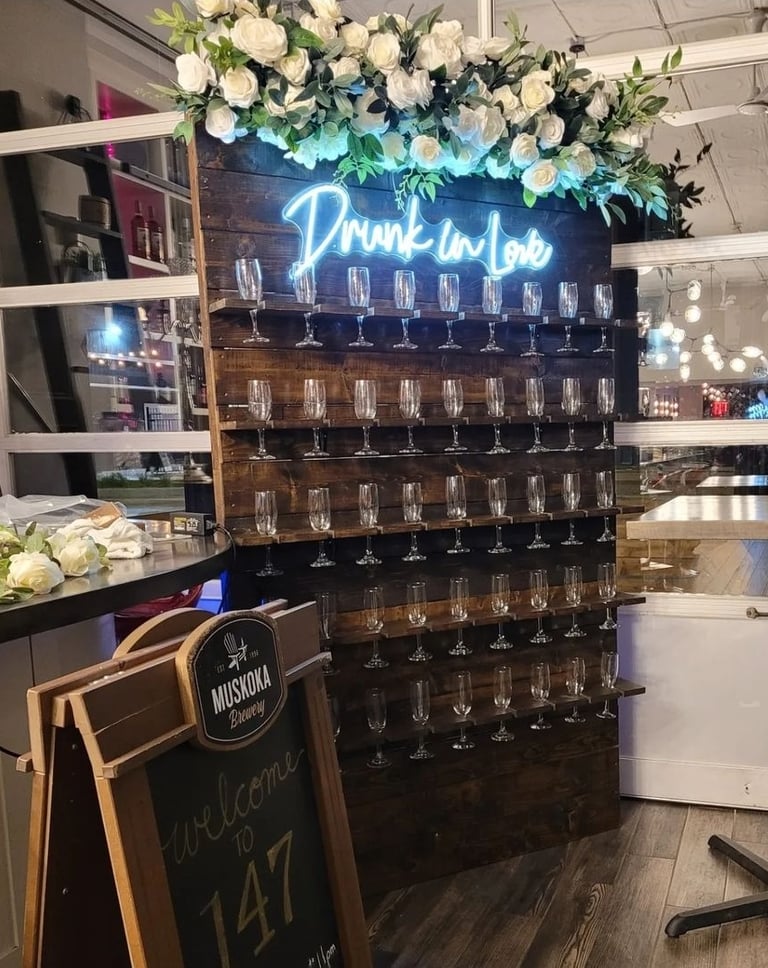 Brown stained champagne with a top floral arrangement drunk in love, champagne flutes