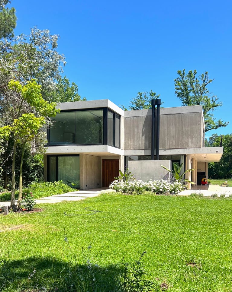 a house with a large lawn and a large house