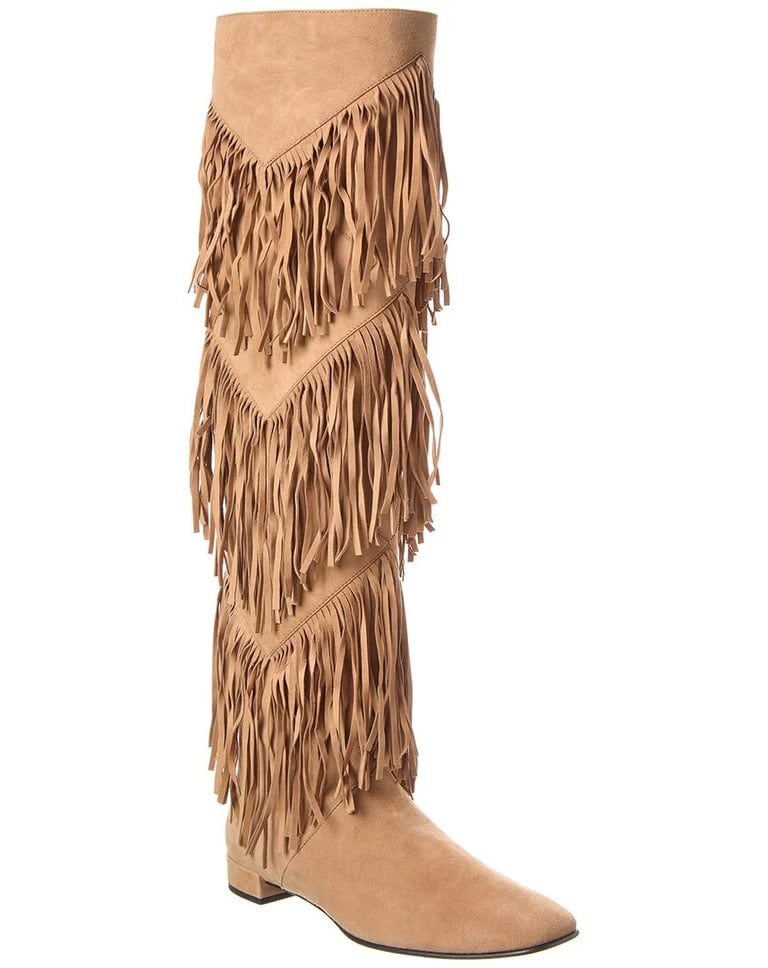 a pair of roger viver suede boots with fringe fringes on them