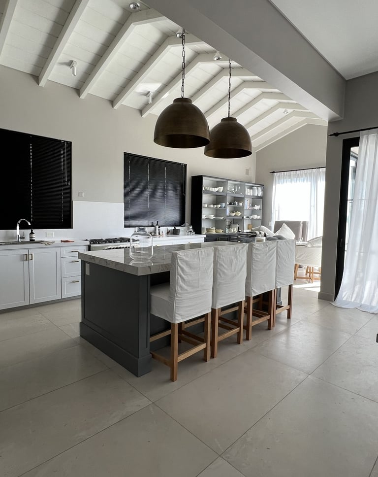 a kitchen with a large island and a large kitchen