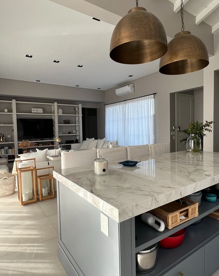 a kitchen island with a marble counter top