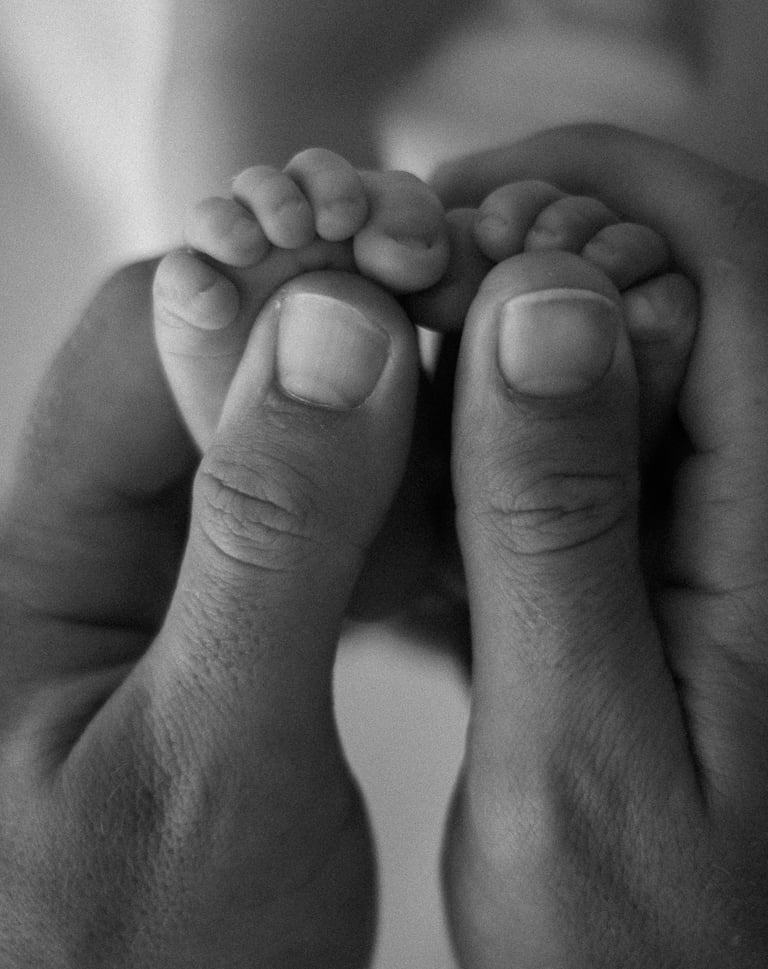 newborn toes in dads hands - natural newborn photography adelaide hills