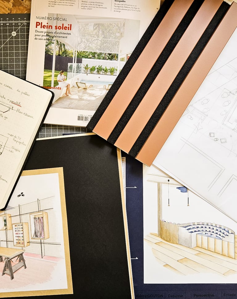 a bunch of drawings of a house on a table