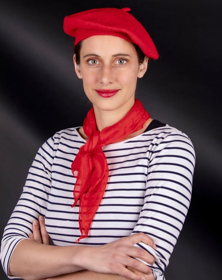 a beautiful French woman teacher in a French costume poses for a picture she is the best tutor