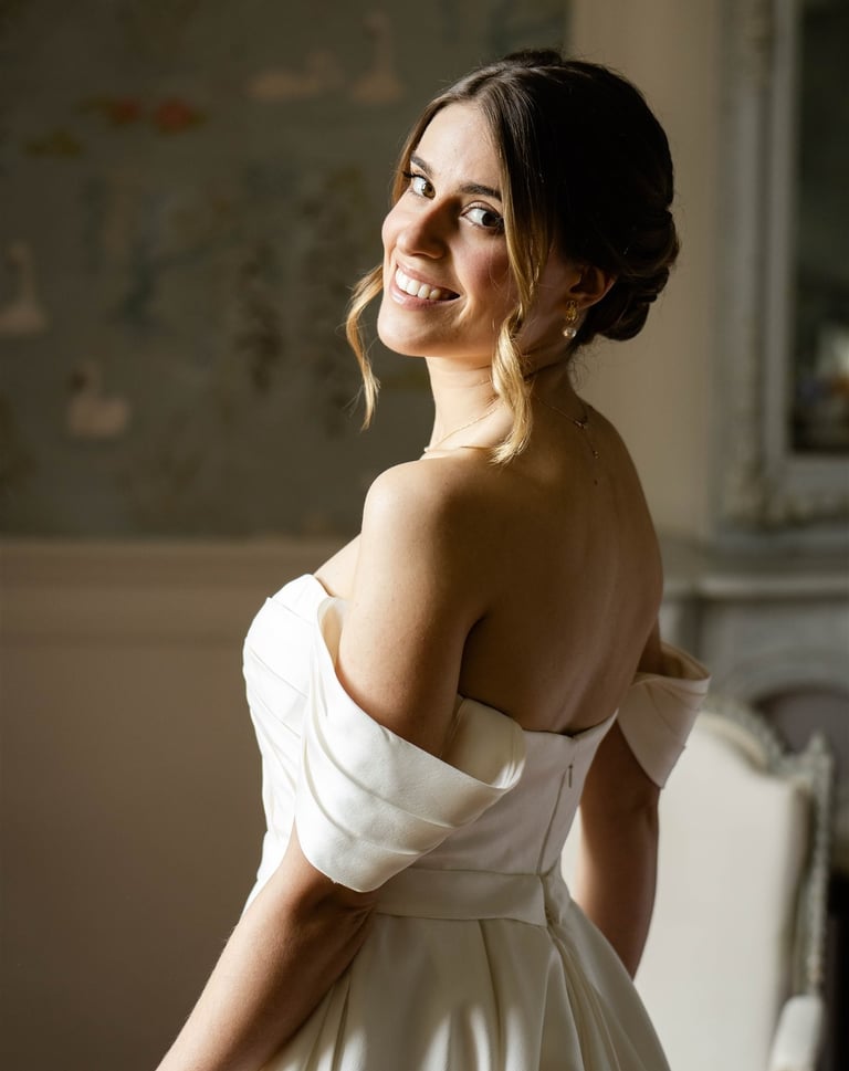 A bride smiling just after getting ready - Editorial, fine art photography