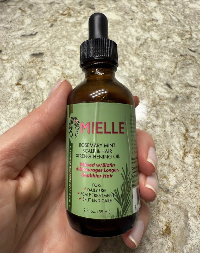 Mielle rosemary mint hair oil for scalp nourishment and natural hair growth
