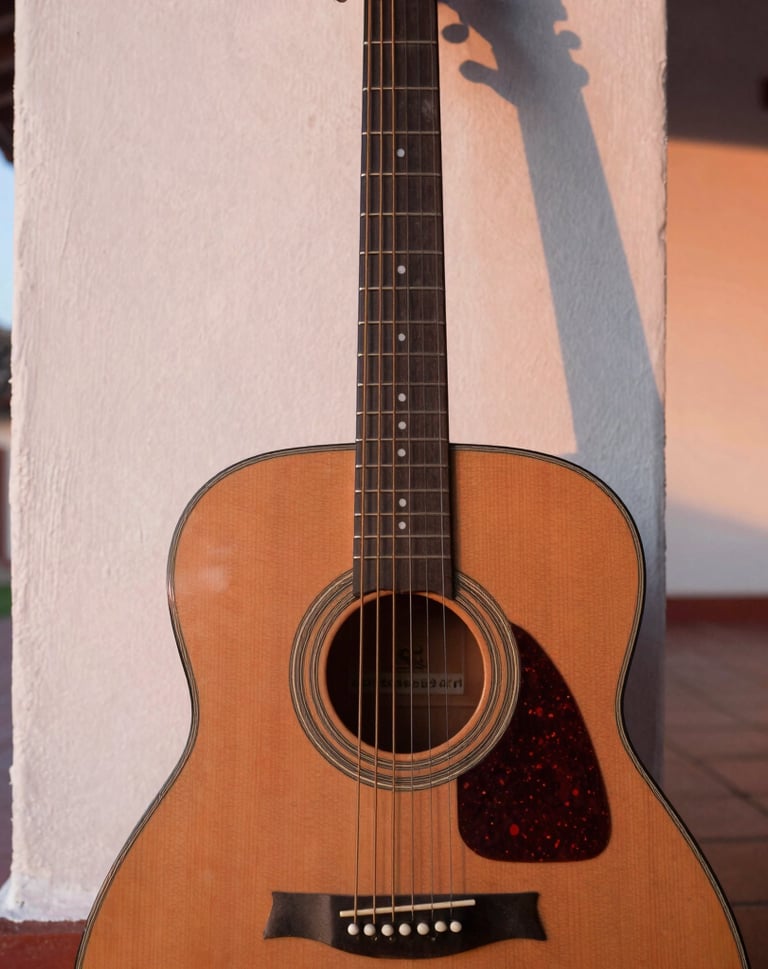 A high-quality close-up of an acoustic guitar leaning against a colonial style wall in a Venezuelan patio during sunset, soft rose and off-white light highlights on the strings.