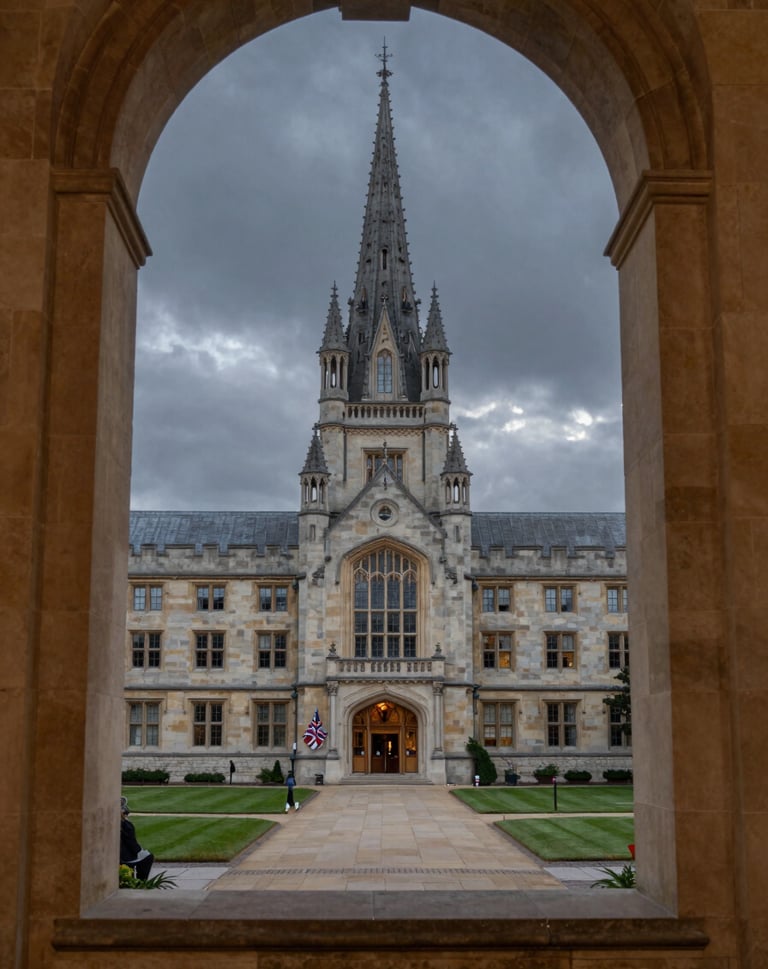 A view of a traditional university courtyard at dusk through a heavy stone window frame. The sky is a muted charcoal, and the stone is a soft cream, evoking a sense of heritage and serious academic identity.