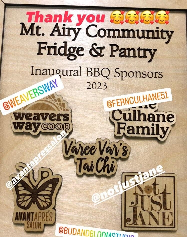 A wooden plaque with names/logos of organizations related to our first bbq.