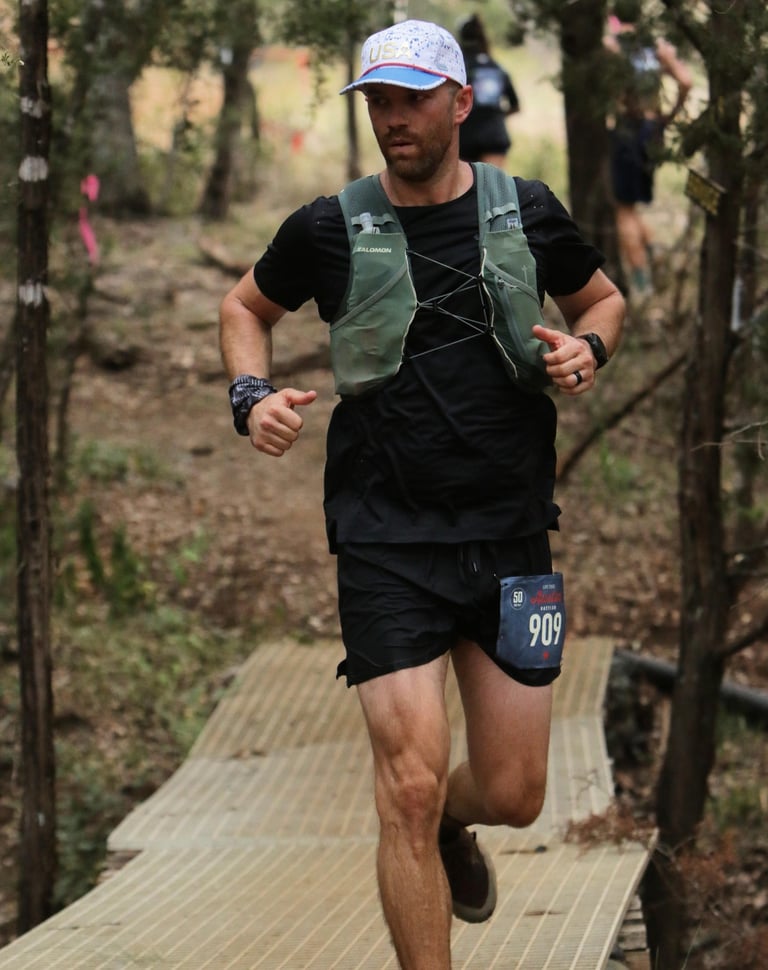 a photo of world class athlete derek pirtle racing the Austin Rattler 50K Ultra Marathon in Texas