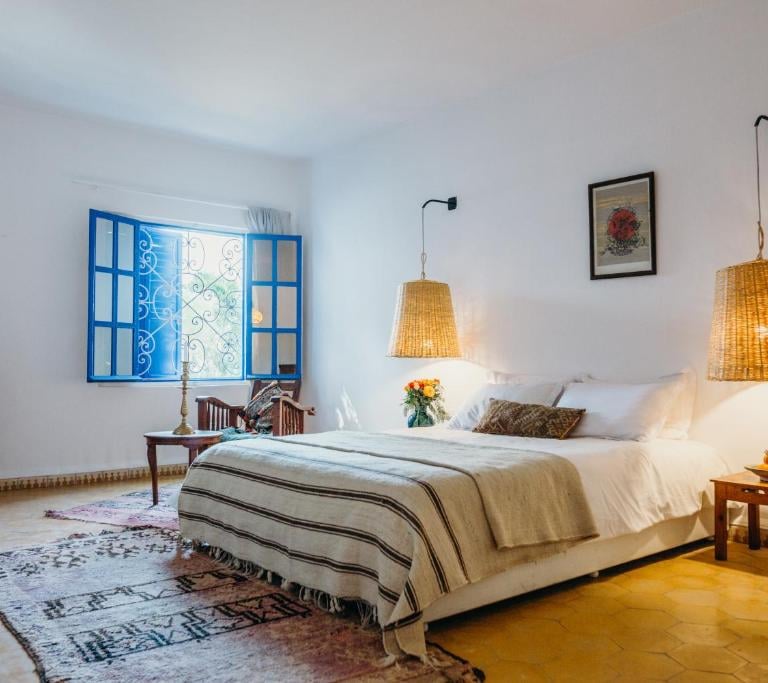 a bedroom with a bed and a fireplace