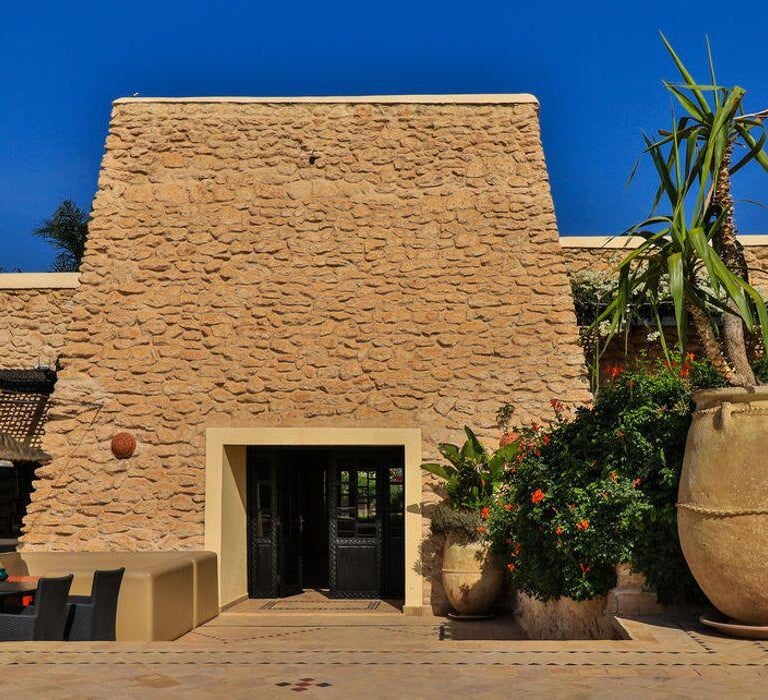 a large potted planter with potted plants
