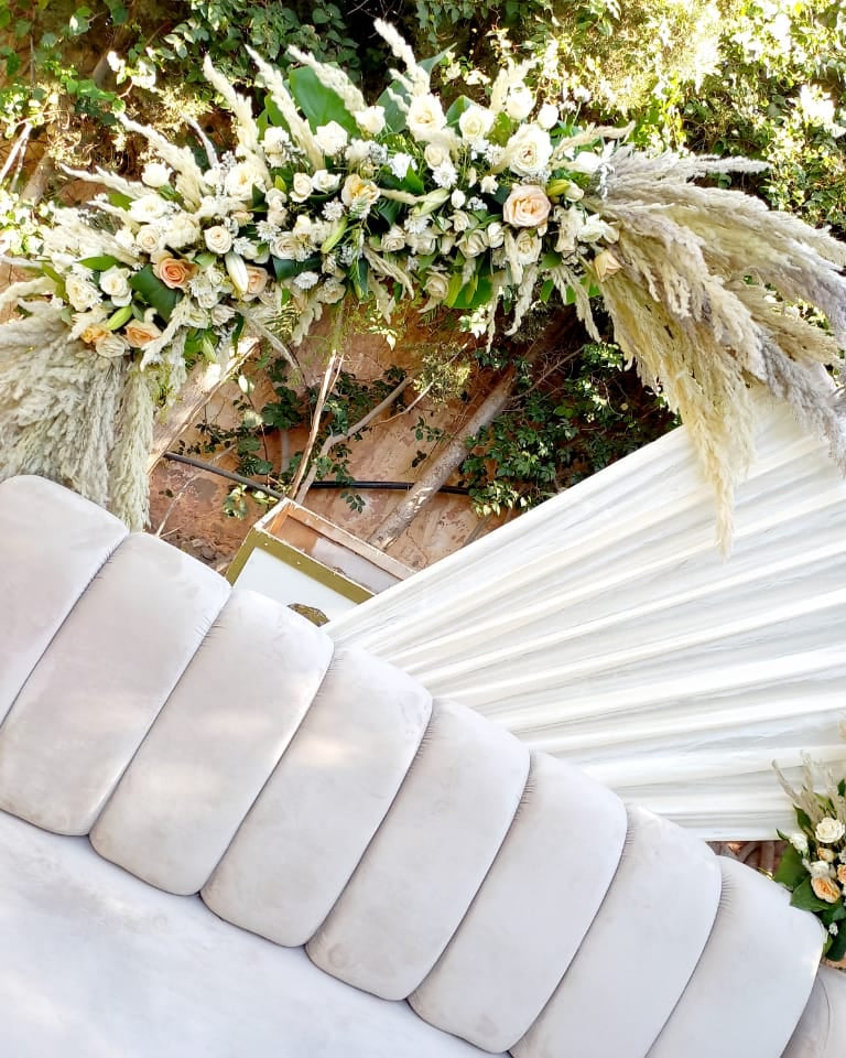 a pool with lounge chairs and a swimming pool