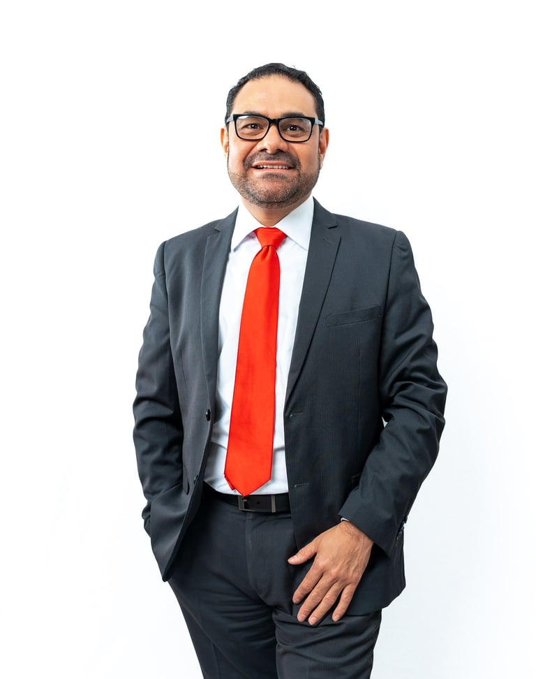 a man in a suit and tie with a red tie