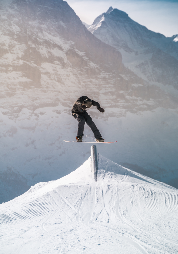 a snowboarder is doing a trick on a snowboard