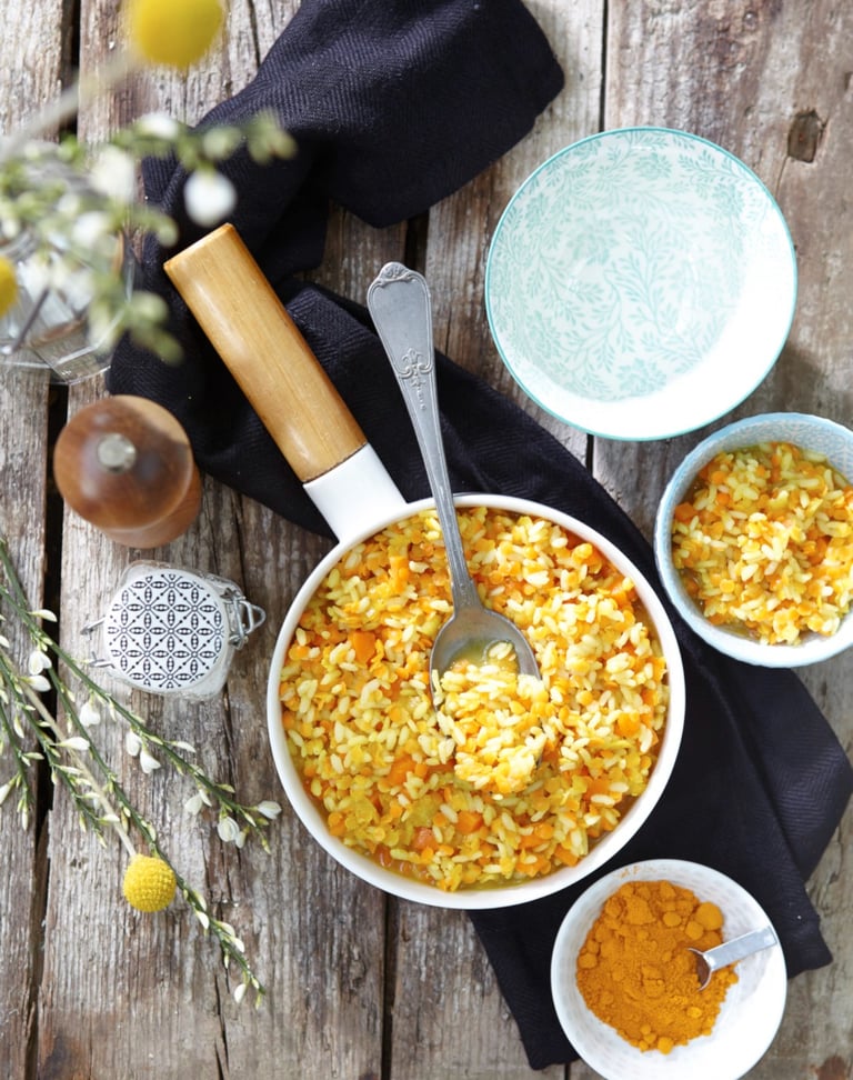 a bowl of food with a spoon and a spoon in it