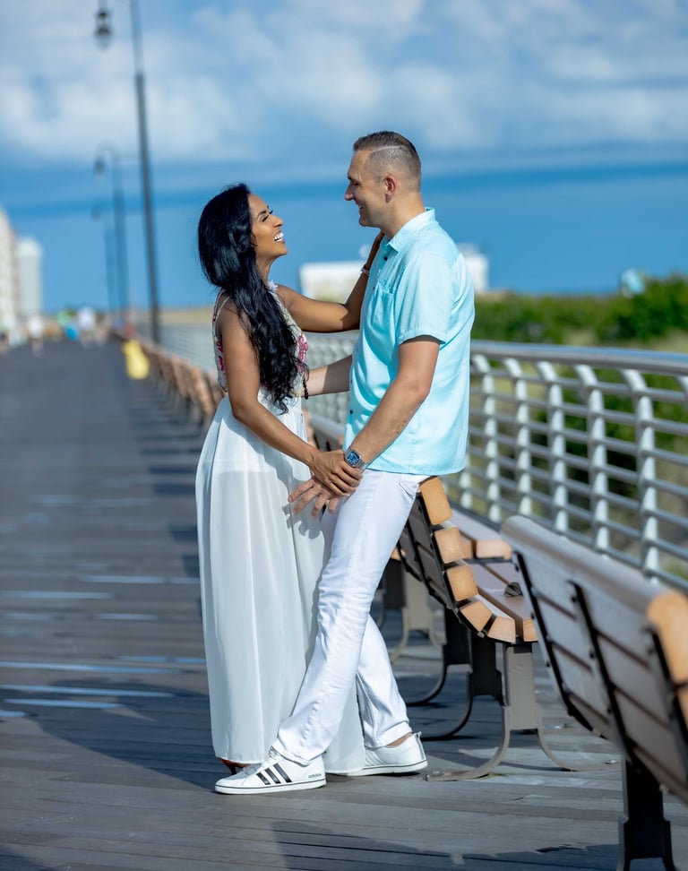 a man and woman standing on a pier