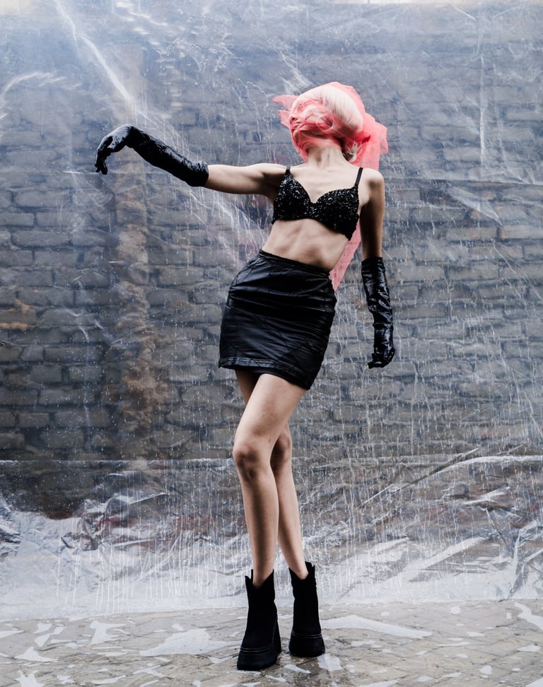 a woman in a black dress and black boots