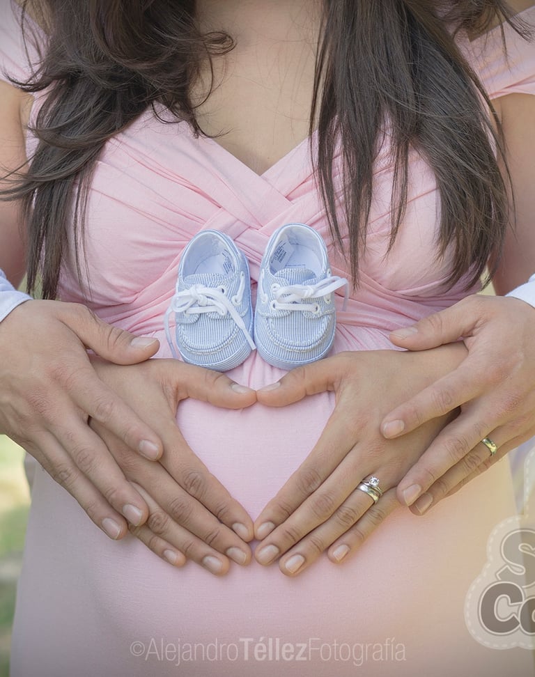 a pregnant woman holding her belly in her belly
