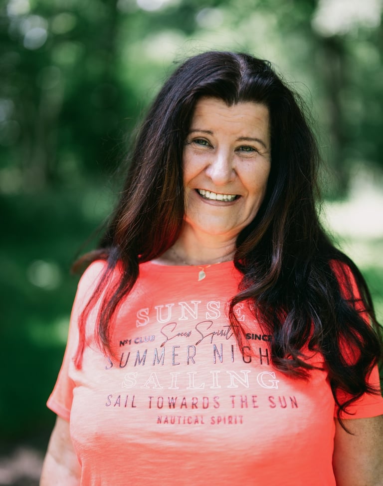 a woman in a bright orange shirt and a red shirt