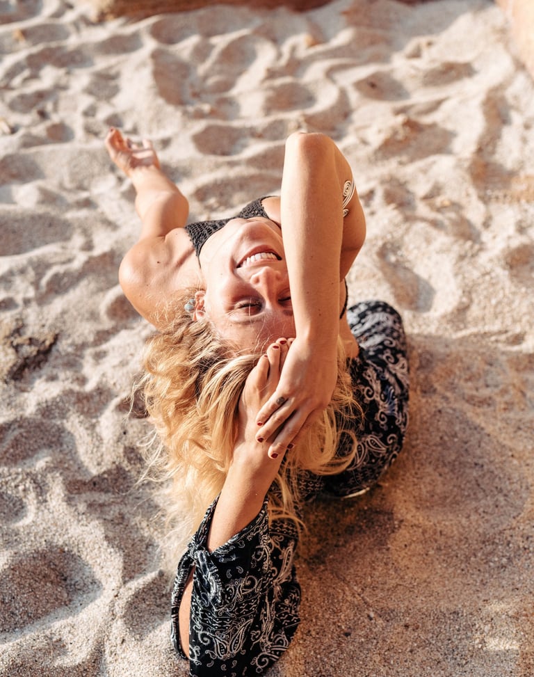 a woman in a black dress doing yoga
