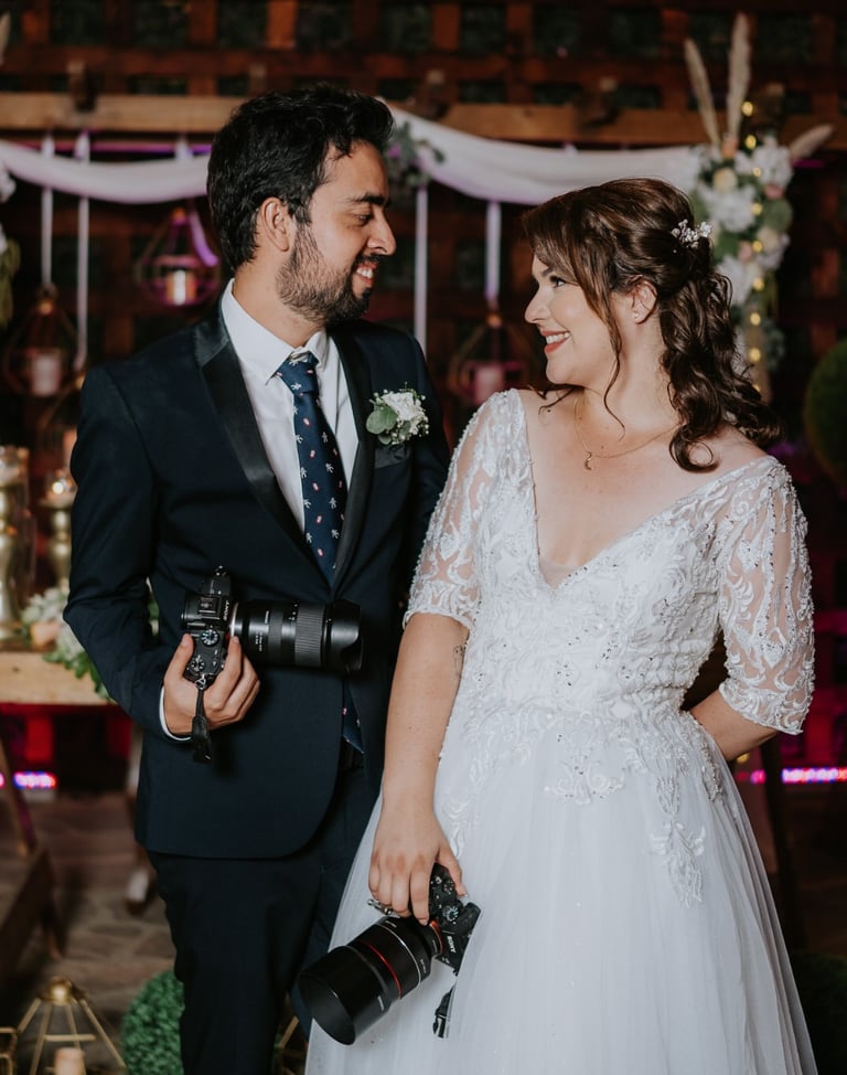 a man and woman standing in front of a wedding ceremony