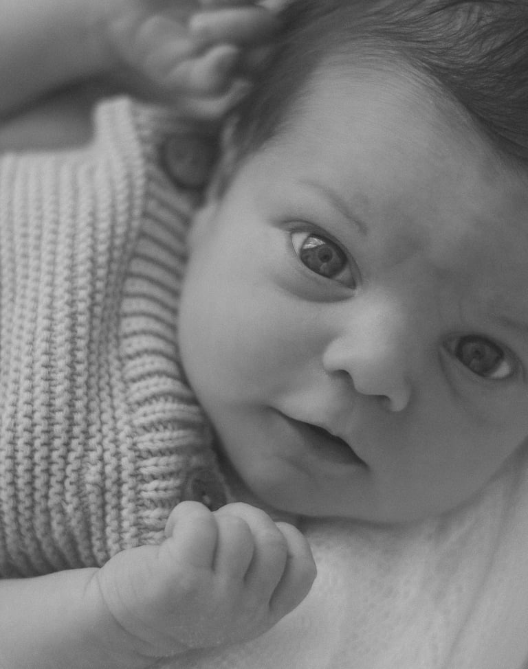 newborn baby looking up at camera, taken in Adelaide studio