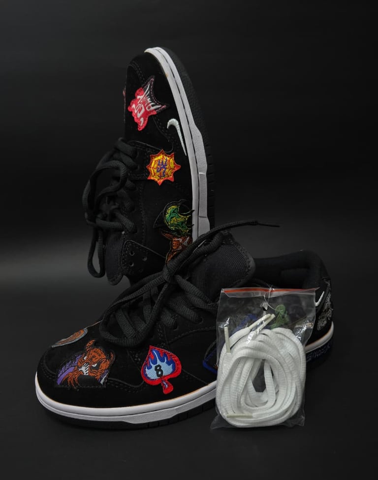 a pair of sneakers with patches and patches on them