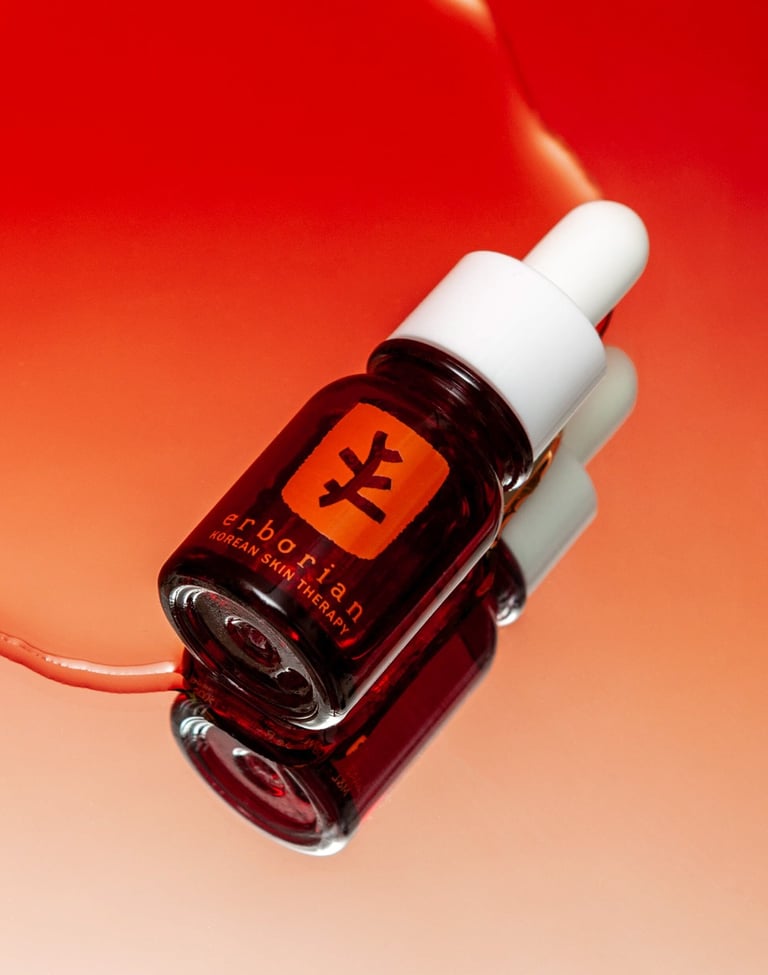 a bottle of cosmetic product in a red backgroud