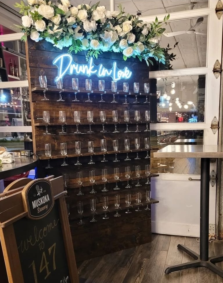 Brown stained champagne with a top floral arrangement drunk in love, champagne flutes