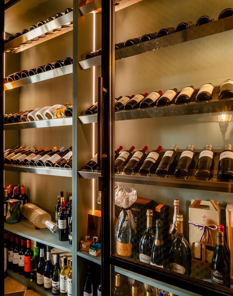 Wine cellar at Villa La Gratitud with backlit shelving and curated bottles
