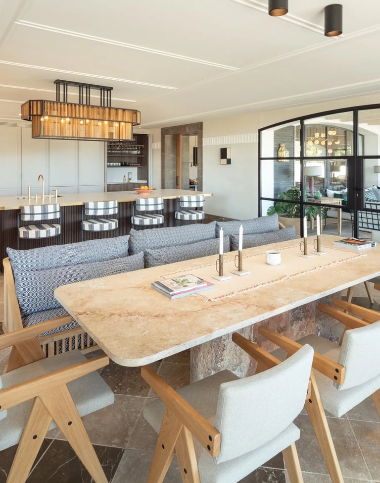 Kitchen at Villa La Gratitud with oak dining table and floor-to-ceiling glass