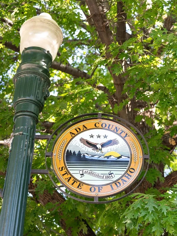 Street light with the Ada County seal displayed in Boise.