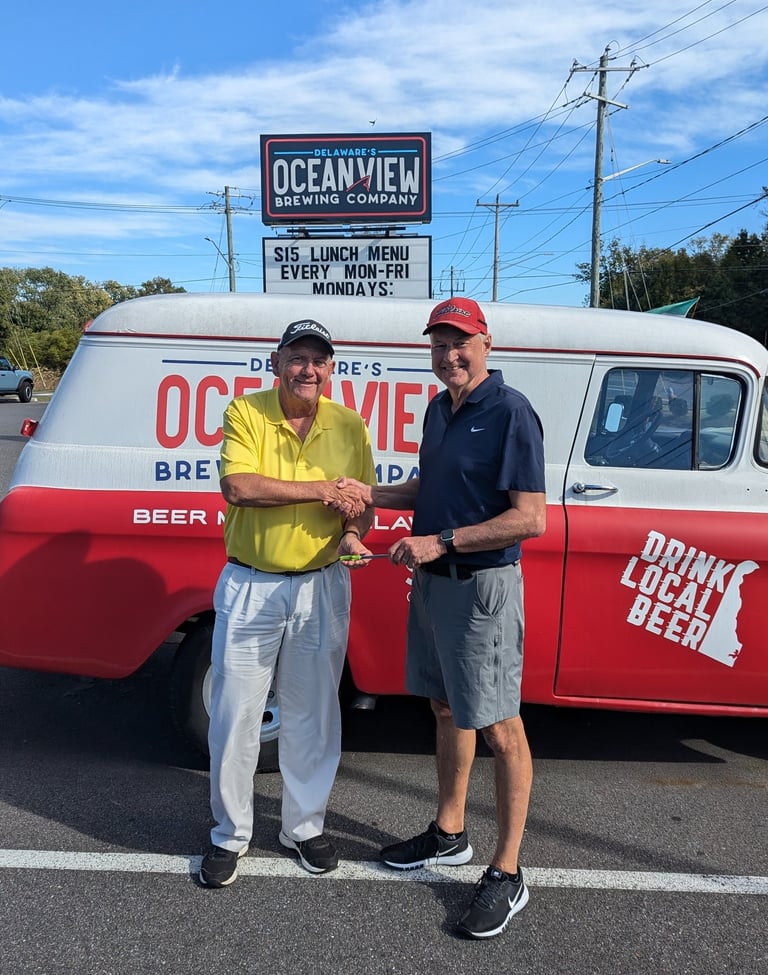 Jeff Paniati receiving Mini-Guinea Trophy from Jeff Lindley