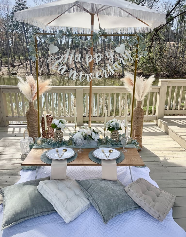 Elegant anniversary intimate celebration luxury picnic with banner, luxe textures, romantic umbrella