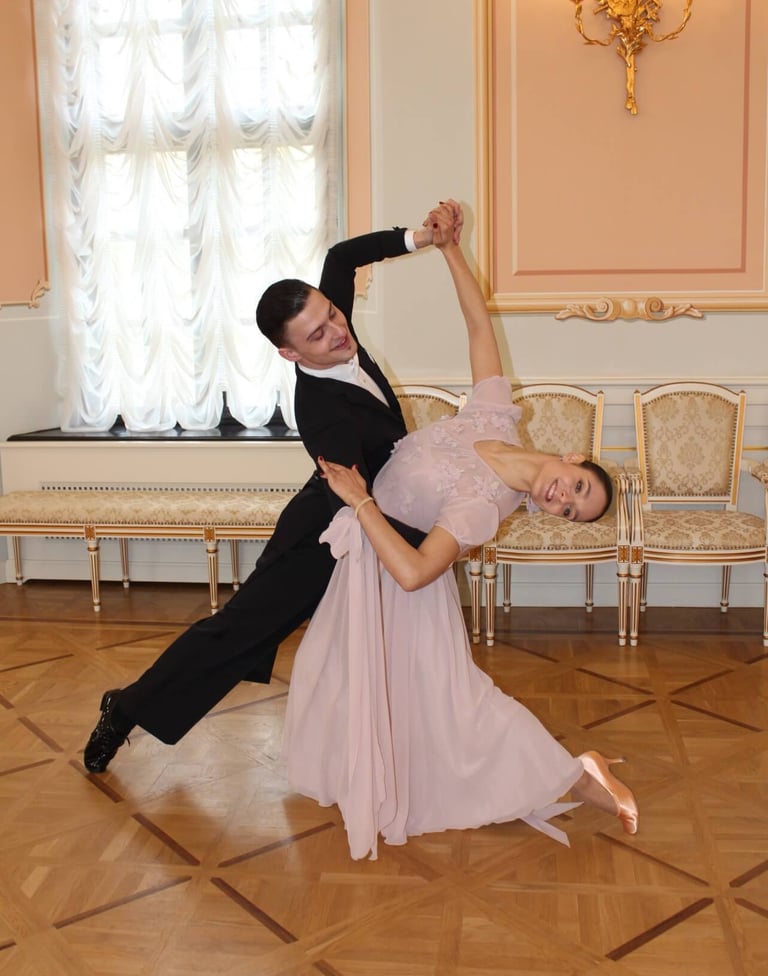 a man and woman dancing in a room