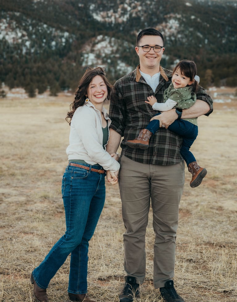 Family portrait of the owner / operators of Peaks and Pines Cleaning Service: Johnathon and Sierra, with their baby Julia.