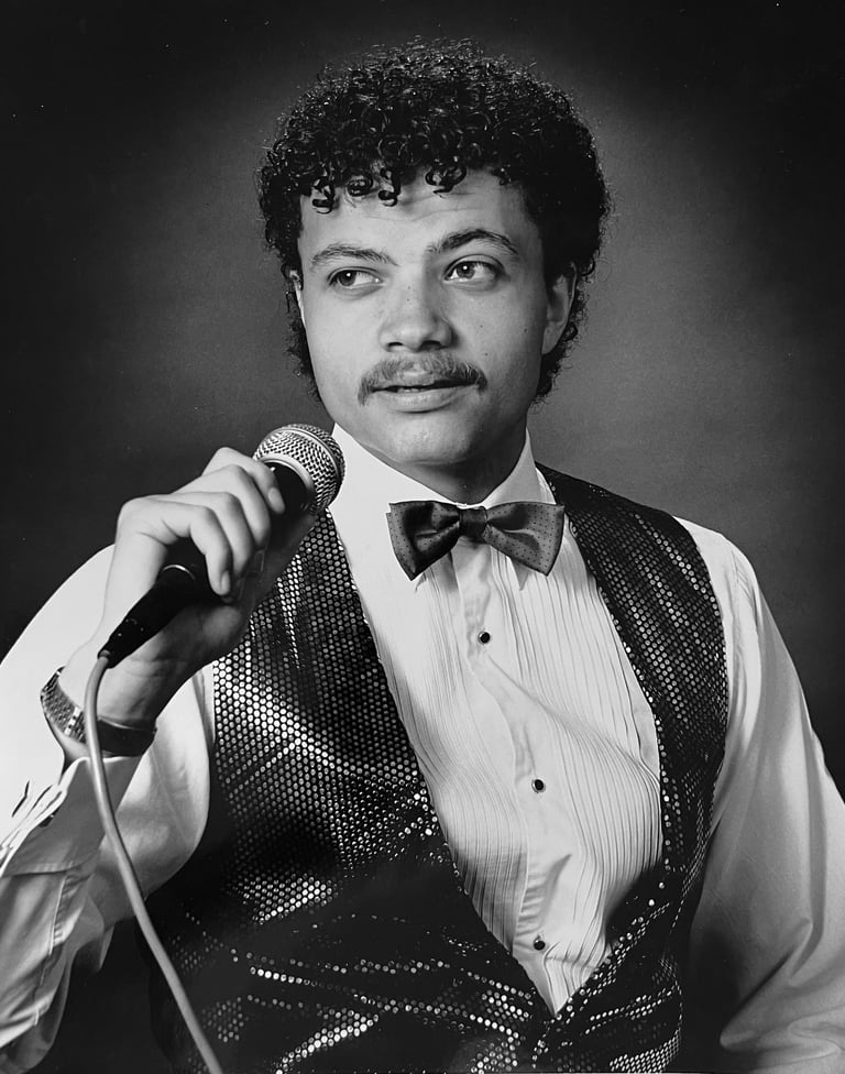 Jon Yon singing and holding a microphone