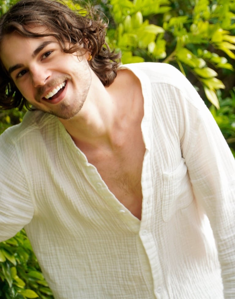 a man with a beard and a white shirt