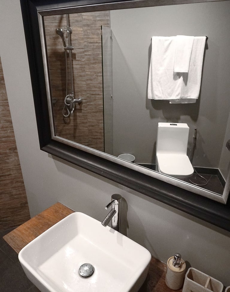 a bathroom sink with a mirror and a sink