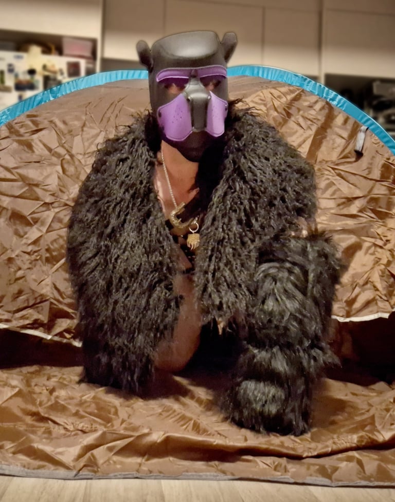 Man in bear mask and fur gear
