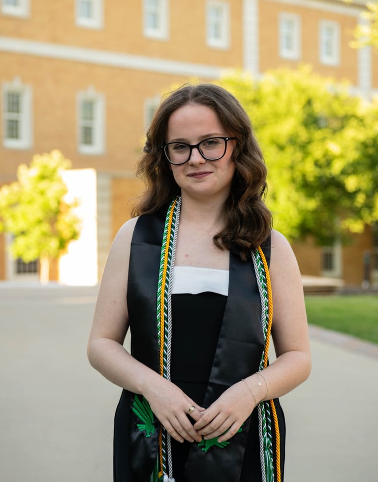 Girl Standing in Graduation Regalia
