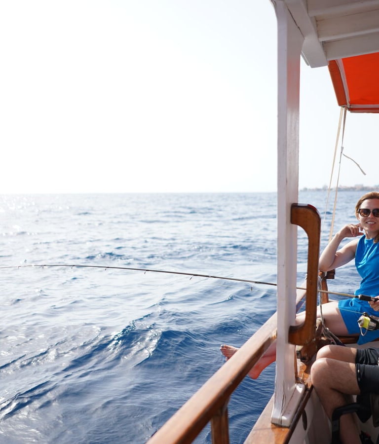 a man in a wheelchair is fishing in the ocean