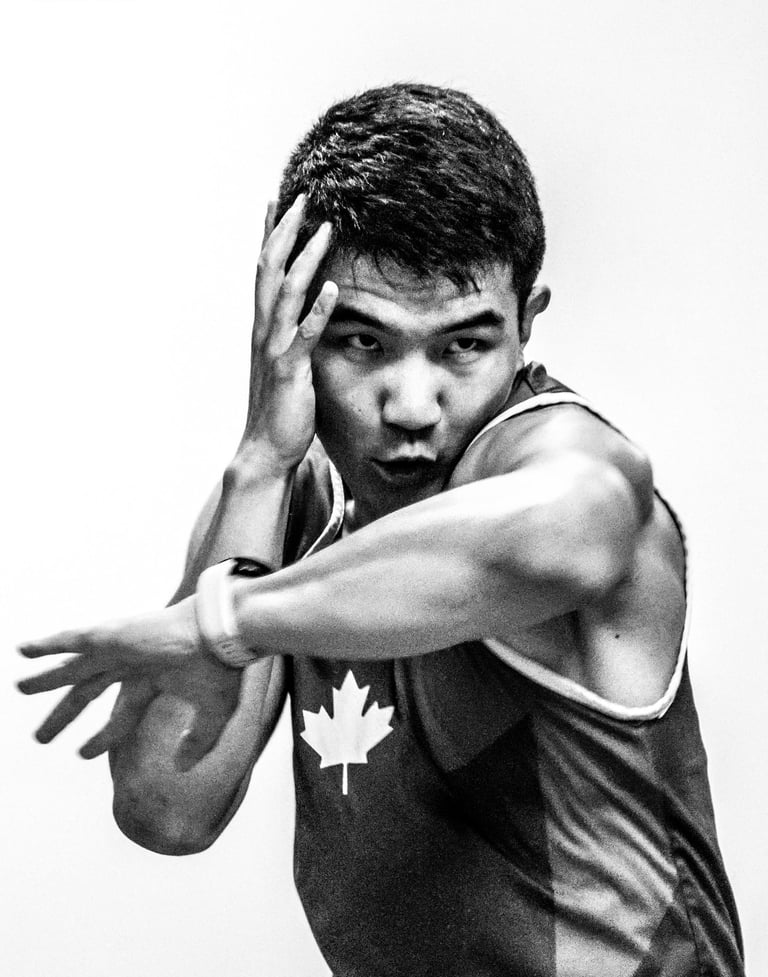 Qianshu has one hand up and his left elbow is striking forward.