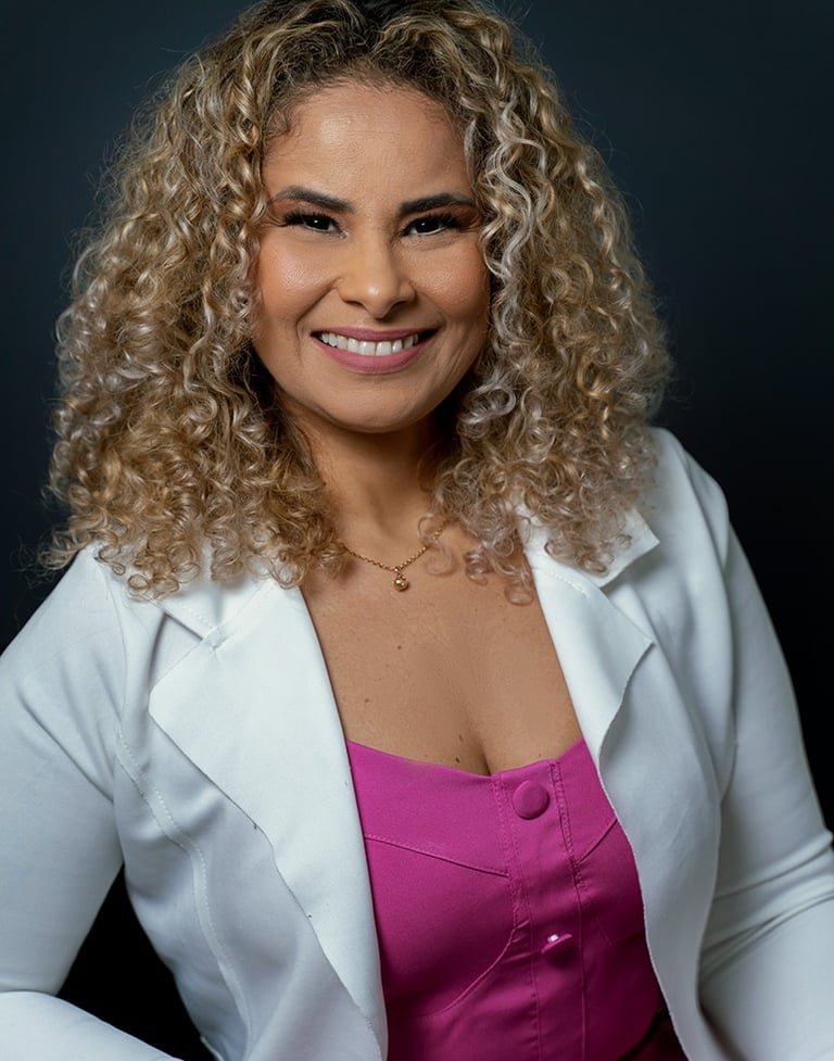 a woman in a white jacket and pink dress