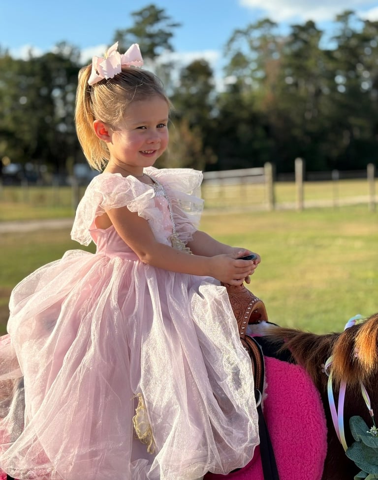 A preschool princess rides Snickers